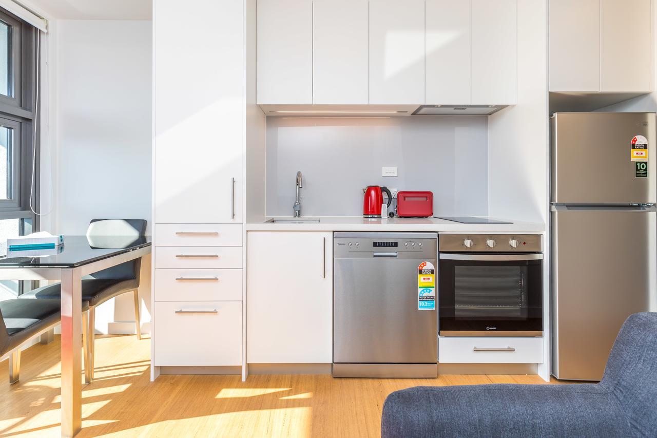 Star Queens Serviced Apartments Auckland Zewnętrze zdjęcie A kitchen in a student apartment at the University of Melbourne